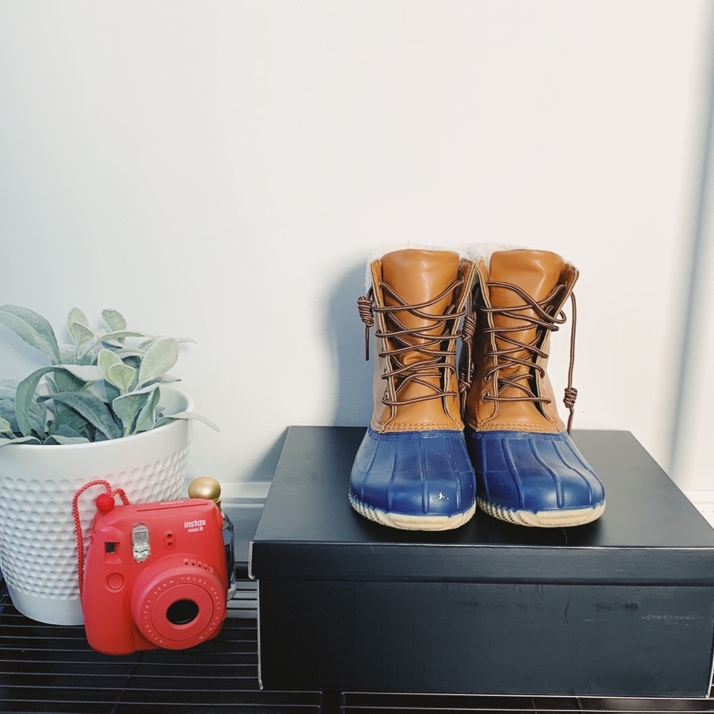 Brown and blue duck boots